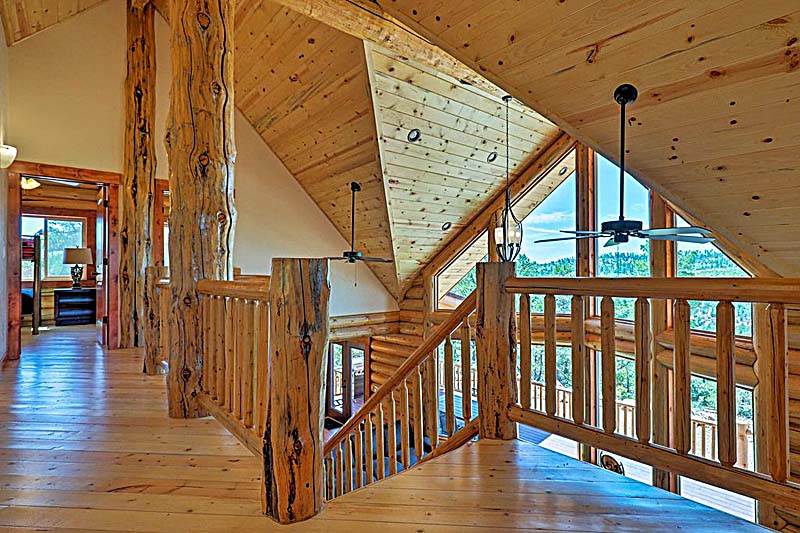 Best log home loft design with giant character logs and TG flooring from Lazarus
