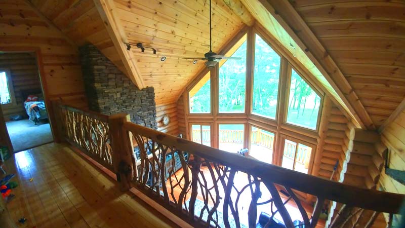 Cascade Lodge Log home design by Lazarus view from loft balcony