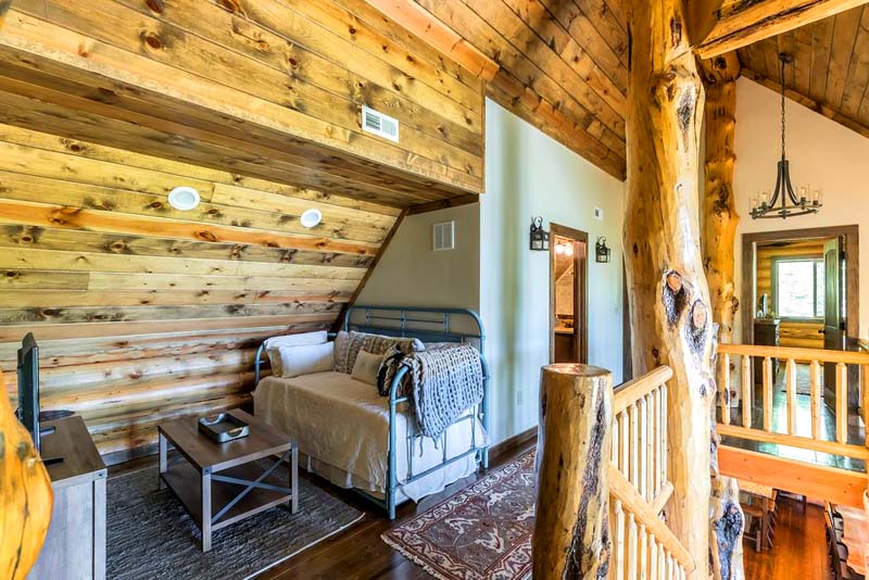Cozy rustic bedroom loft with wooden interior design