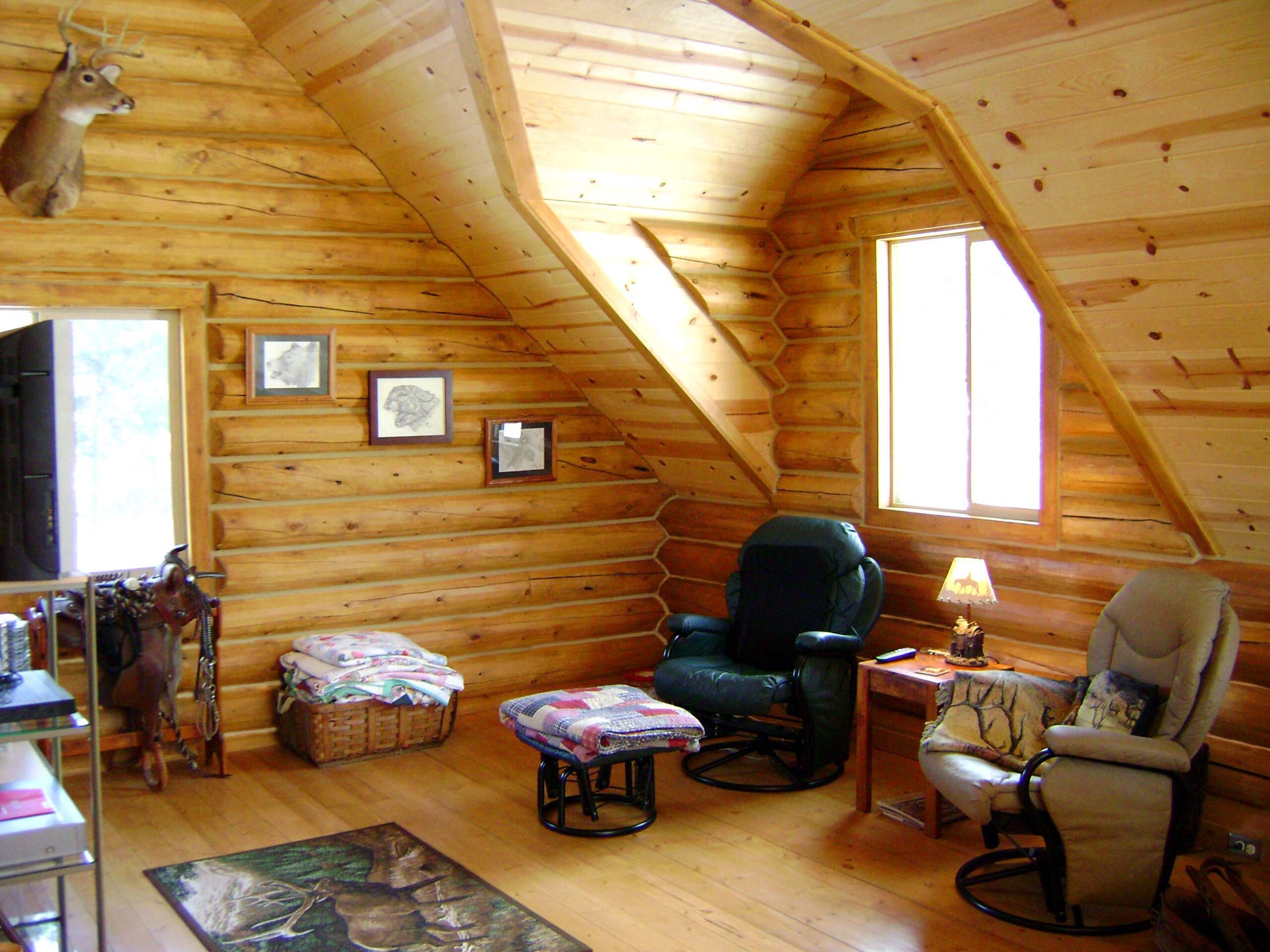 Cozy log cabin attic with rustic wooden walls and furniture