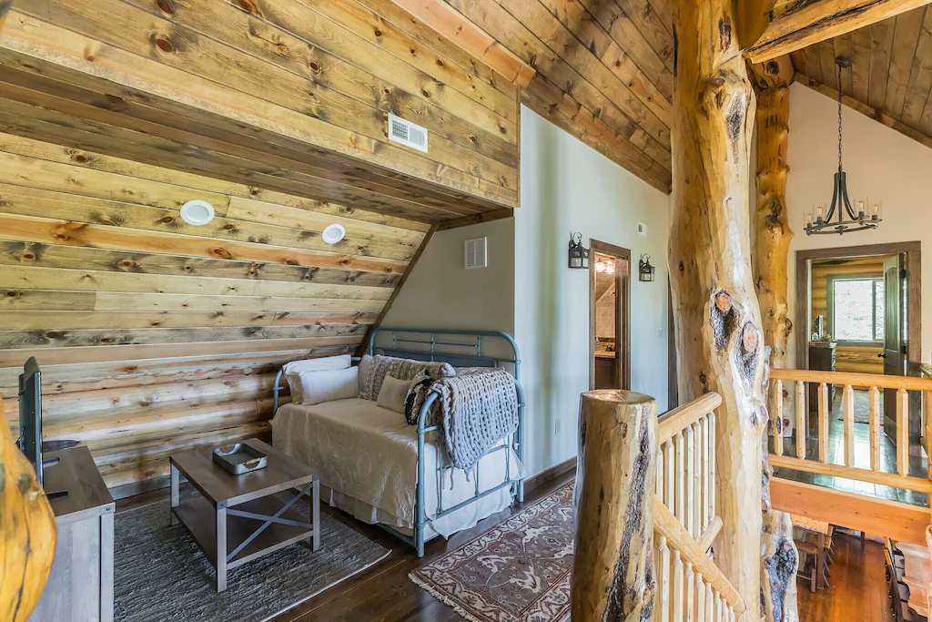 Rustic loft interior with wooden walls and cozy seating area