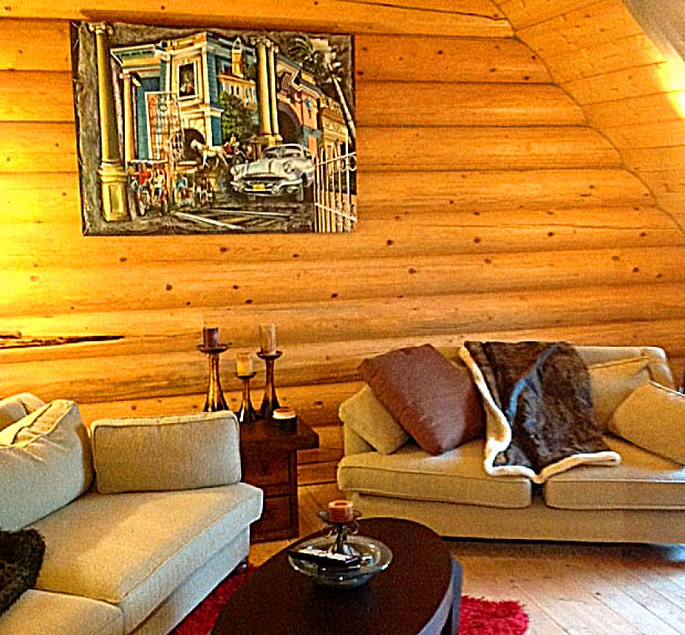 Cozy log cabin living room with sofas and rustic decor