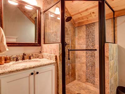 Rustic bathroom with stone shower and wooden ceiling design