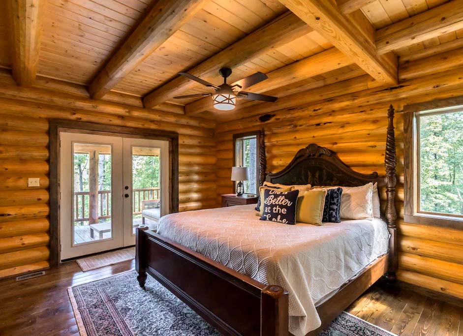 Cozy rustic log cabin bedroom with wooden beams and decor