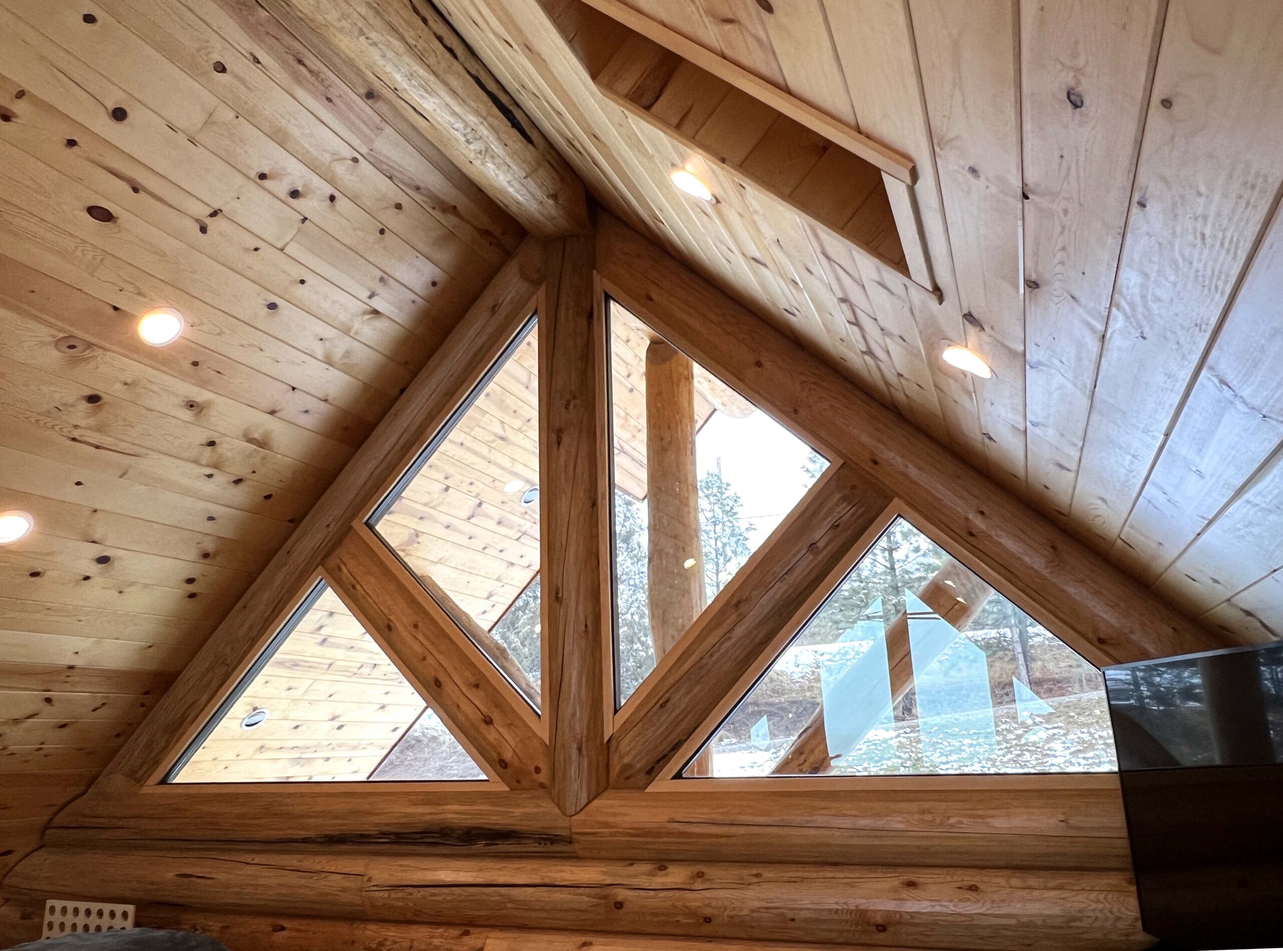 Triangular wooden attic window with natural lighting
