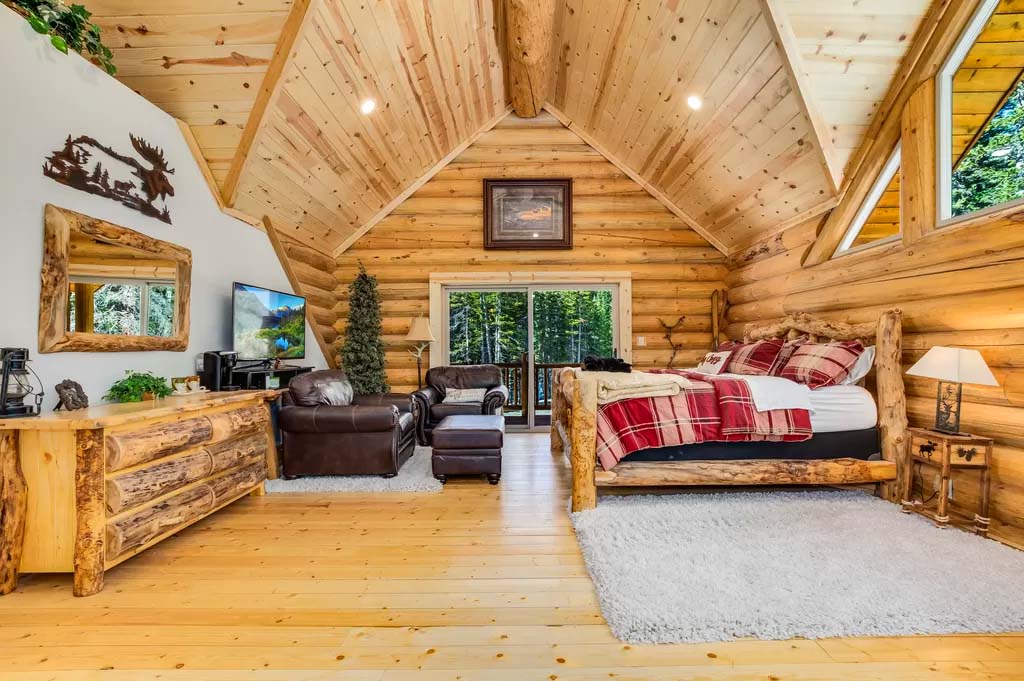 Cozy rustic cabin bedroom with wooden furniture and decor
