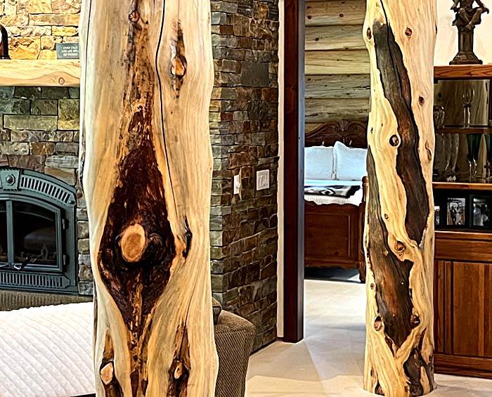 Rustic wooden columns in cozy living room interior design