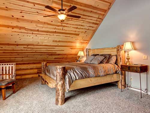 Rustic bedroom with wooden bed frame and cozy decor