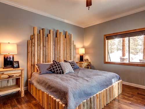 Rustic bedroom with wooden bed frame and cozy decor
