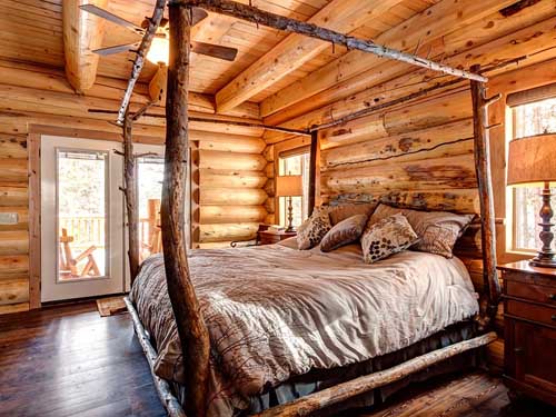 Cozy log cabin bedroom with wooden accents