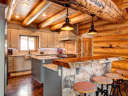 Rustic wooden kitchen with log beams and stone countertop